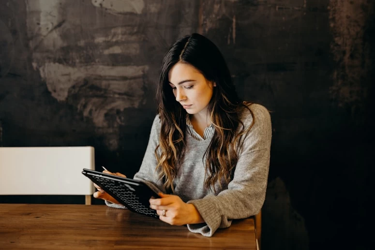 Person browsing on tablet